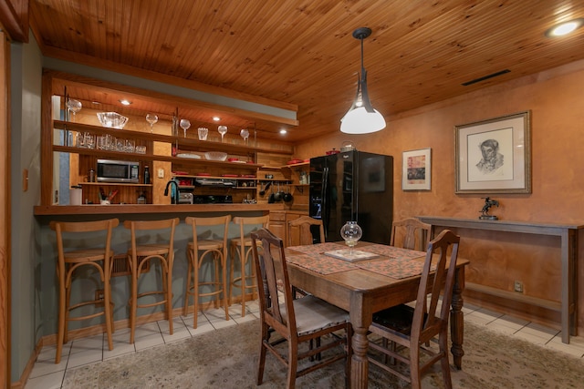 7901 N Chesley Dr, Columbia, MO 65202 - dining space featuring light tile patterned floors, wooden ceiling, and recessed lighting