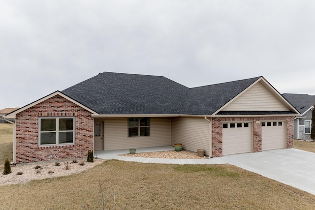 16110 Blue Heron Dr, Ashland, MO 65010 - view of front of home featuring an attached garage, roof with shingles, brick siding, a front lawn, and concrete driveway