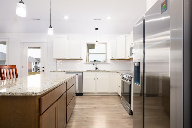 16110 Blue Heron Dr, Ashland, MO 65010 - kitchen with appliances with stainless steel finishes, a sink, plenty of natural light, decorative backsplash, and recessed lighting