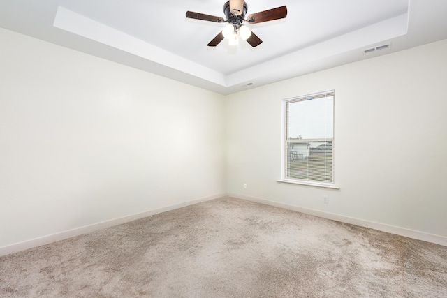 16110 Blue Heron Dr, Ashland, MO 65010 - carpeted spare room with a raised ceiling, baseboards, and ceiling fan