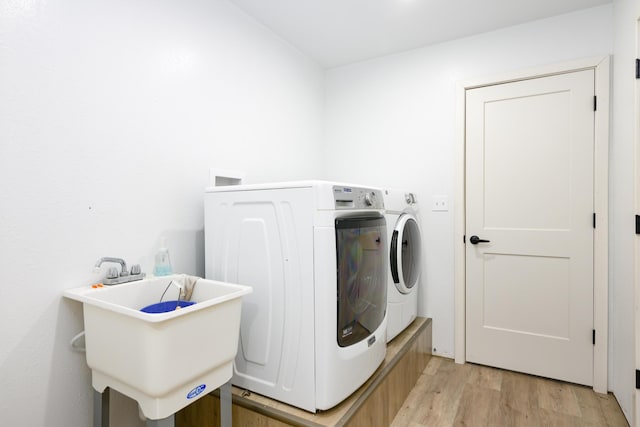 16110 Blue Heron Dr, Ashland, MO 65010 - laundry room with washing machine and clothes dryer and light wood-style flooring
