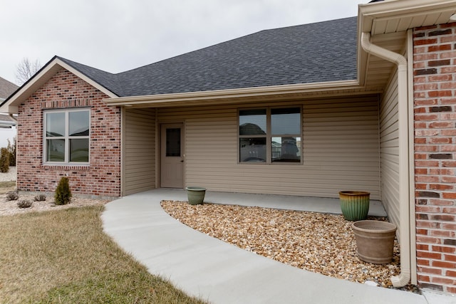 16110 Blue Heron Dr, Ashland, MO 65010 - view of exterior entry featuring roof with shingles and brick siding