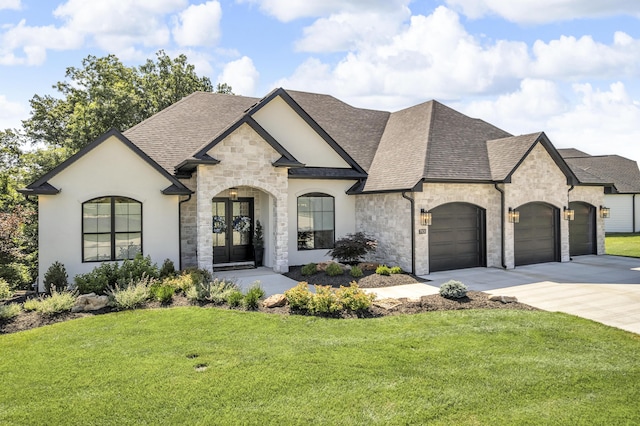 7501 Kirby Knowle Ct, Columbia, MO 65203 - french country home with french doors, stone siding, concrete driveway, and a shingled roof