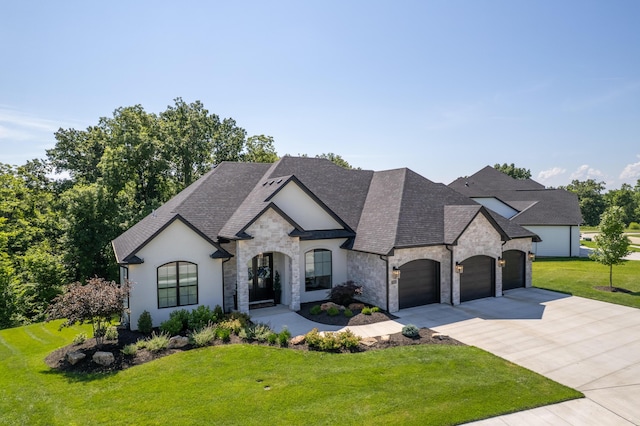 7501 Kirby Knowle Ct, Columbia, MO 65203 - french provincial home featuring stone siding, concrete driveway, a front lawn, roof with shingles, and a garage