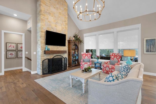 7501 Kirby Knowle Ct, Columbia, MO 65203 - living room featuring high vaulted ceiling, a fireplace, wood finished floors, a chandelier, and recessed lighting