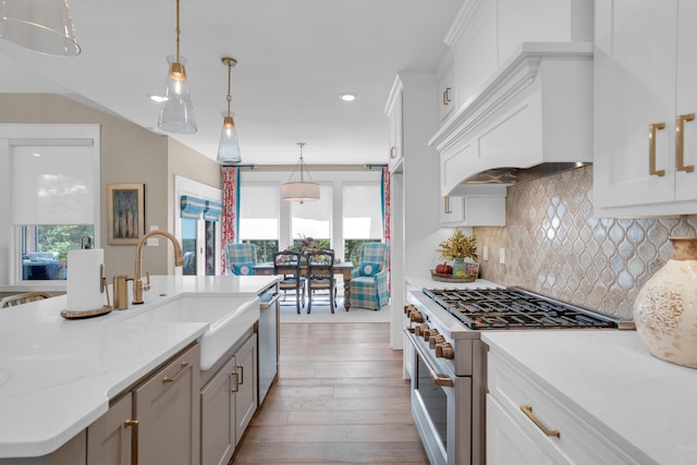 7501 Kirby Knowle Ct, Columbia, MO 65203 - kitchen with appliances with stainless steel finishes, hardwood / wood-style floors, healthy amount of natural light, recessed lighting, and white cabinets
