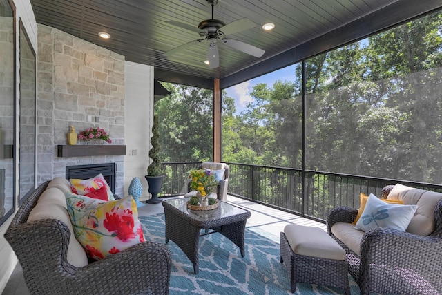 7501 Kirby Knowle Ct, Columbia, MO 65203 - sunroom / solarium with a ceiling fan and an outdoor living space with a fireplace