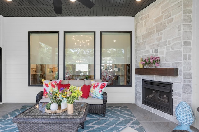 7501 Kirby Knowle Ct, Columbia, MO 65203 - view of patio / terrace featuring a stone fireplace and a ceiling fan