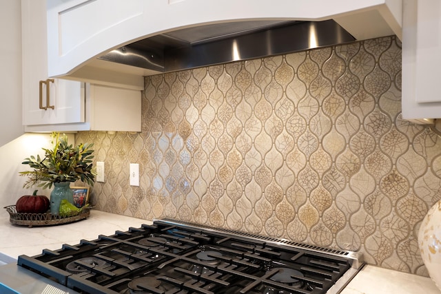 7501 Kirby Knowle Ct, Columbia, MO 65203 - kitchen view of premium range hood, decorative backsplash, and white cabinetry