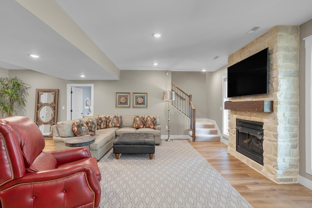 7501 Kirby Knowle Ct, Columbia, MO 65203 - living area with wood finished floors, stairs, a fireplace, and recessed lighting