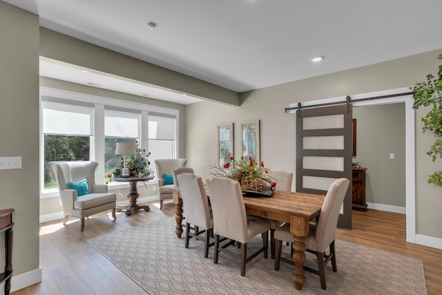 7501 Kirby Knowle Ct, Columbia, MO 65203 - dining area with a barn door, light wood-type flooring, and recessed lighting