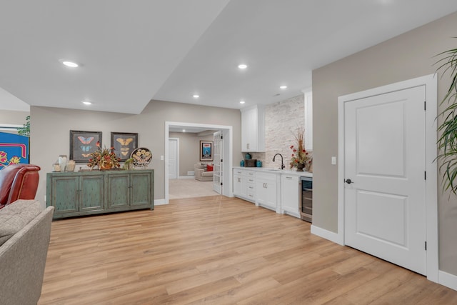 7501 Kirby Knowle Ct, Columbia, MO 65203 - indoor bar featuring light wood finished floors, recessed lighting, and wine cooler