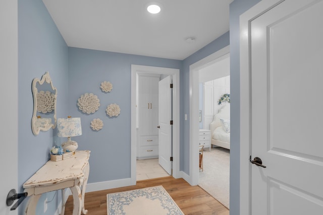 7501 Kirby Knowle Ct, Columbia, MO 65203 - hallway with baseboards and light wood-type flooring