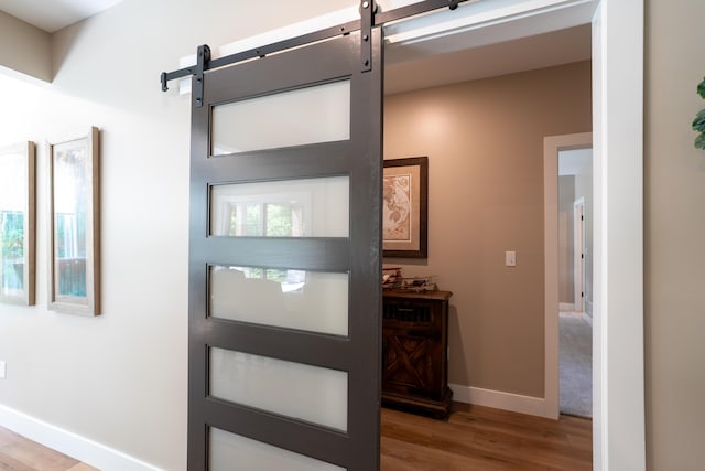 7501 Kirby Knowle Ct, Columbia, MO 65203 - entrance foyer with a barn door and wood finished floors