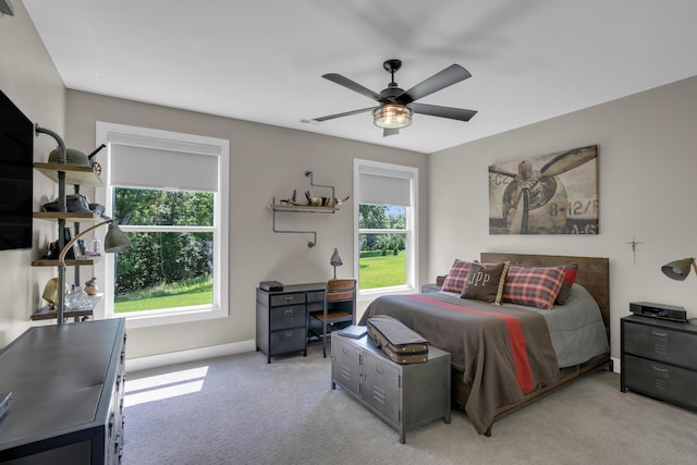 7501 Kirby Knowle Ct, Columbia, MO 65203 - bedroom with multiple windows, light carpet, and a ceiling fan