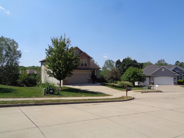 712 Anaconda Ct, Columbia, MO 65202 - obstructed view of property featuring driveway, a front yard, and an attached garage