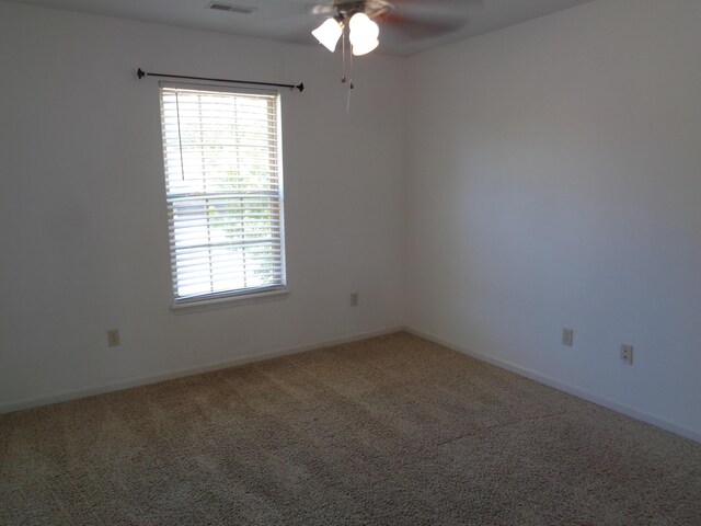 712 Anaconda Ct, Columbia, MO 65202 - carpeted spare room featuring a ceiling fan, healthy amount of natural light, and baseboards