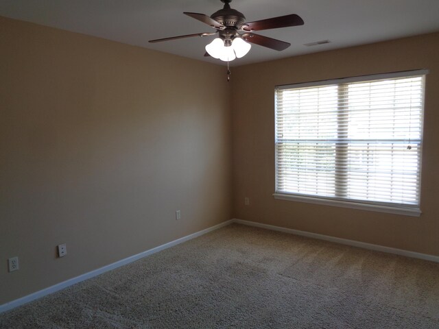 712 Anaconda Ct, Columbia, MO 65202 - unfurnished room featuring a ceiling fan, carpet, plenty of natural light, and baseboards