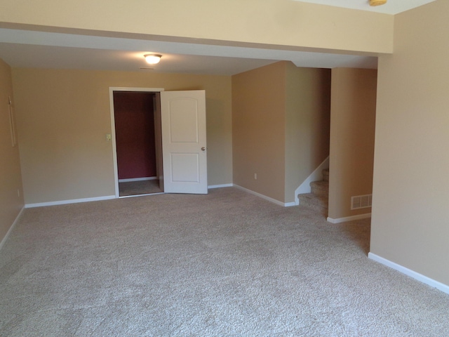 712 Anaconda Ct, Columbia, MO 65202 - empty room featuring carpet floors, baseboards, and stairway