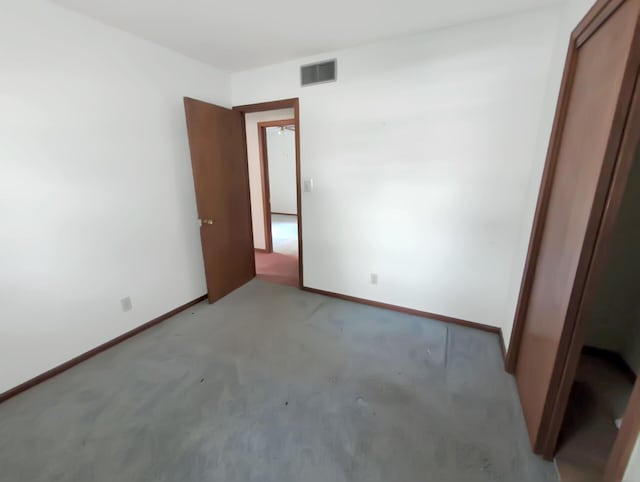 28 E Rosehill St, Marshall, MO 65340 - unfurnished bedroom with light carpet, baseboards, and a closet