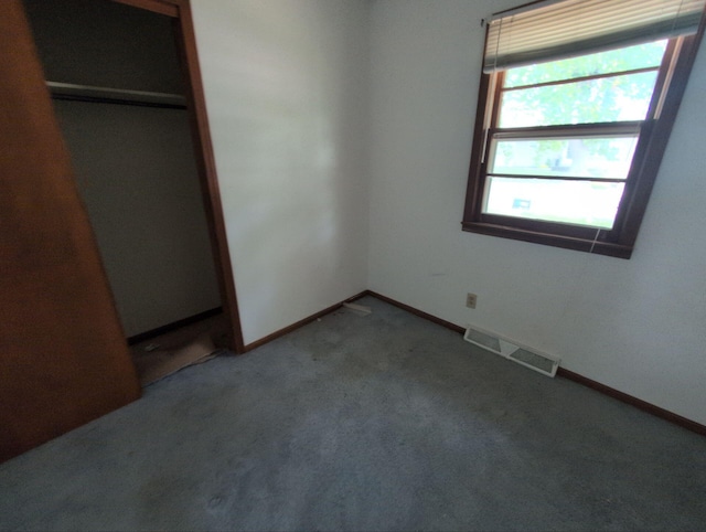28 E Rosehill St, Marshall, MO 65340 - unfurnished bedroom with carpet floors, baseboards, and a closet