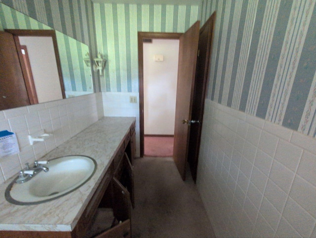 28 E Rosehill St, Marshall, MO 65340 - bathroom featuring wallpapered walls, vanity, and wainscoting