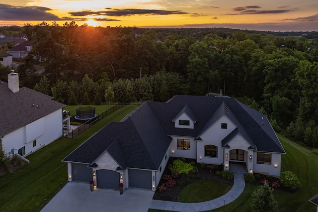 7305 Sella Ct, Columbia, MO 65203 - aerial view at dusk of a wooded view