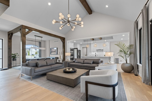 7305 Sella Ct, Columbia, MO 65203 - living room featuring a chandelier, light wood finished floors, beamed ceiling, and high vaulted ceiling