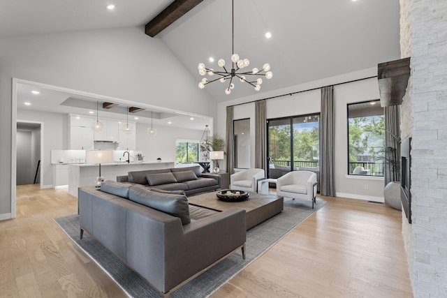 7305 Sella Ct, Columbia, MO 65203 - living room featuring high vaulted ceiling, beamed ceiling, light wood-style floors, baseboards, and a chandelier
