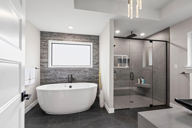 7305 Sella Ct, Columbia, MO 65203 - full bath with a shower stall, a freestanding tub, baseboards, tile patterned floors, and recessed lighting
