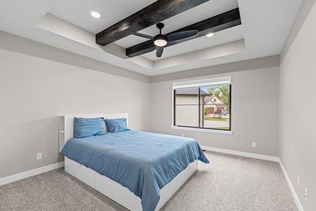 7305 Sella Ct, Columbia, MO 65203 - carpeted bedroom with a tray ceiling, baseboards, a ceiling fan, and beam ceiling