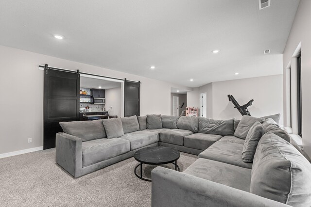 7305 Sella Ct, Columbia, MO 65203 - living room with a barn door, carpet floors, recessed lighting, and baseboards