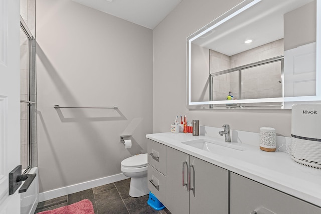 7305 Sella Ct, Columbia, MO 65203 - bathroom with toilet, vanity, and baseboards