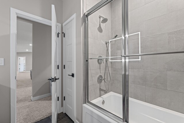 7305 Sella Ct, Columbia, MO 65203 - bathroom with shower / bath combination with glass door and baseboards