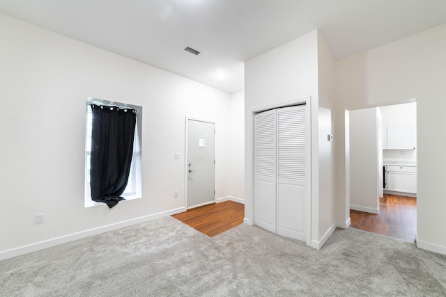 210 Oaklawn Ave, Fayette, MO 65248 - unfurnished bedroom with carpet floors, baseboards, and a closet