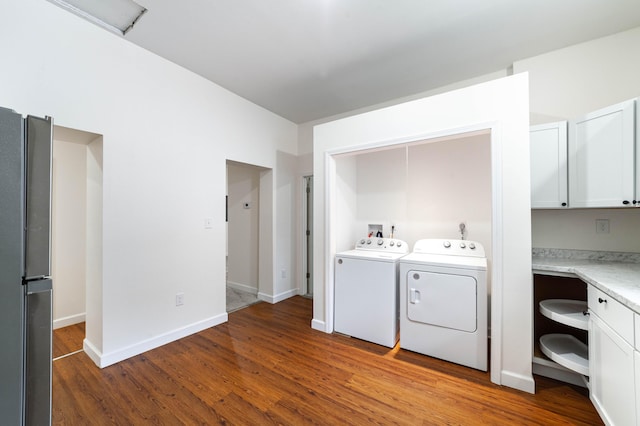 210 Oaklawn Ave, Fayette, MO 65248 - laundry room with independent washer and dryer, wood finished floors, and baseboards