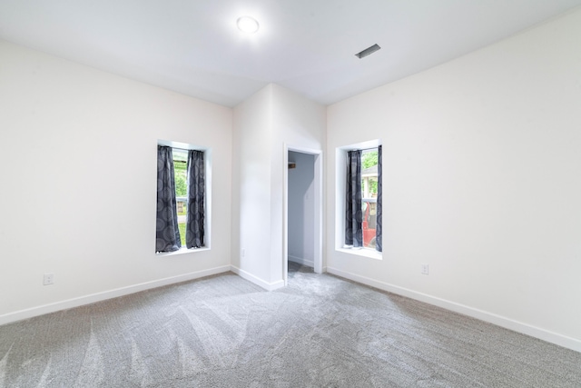 210 Oaklawn Ave, Fayette, MO 65248 - carpeted empty room featuring healthy amount of natural light and baseboards