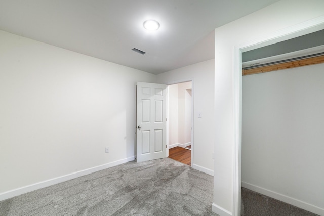 210 Oaklawn Ave, Fayette, MO 65248 - unfurnished bedroom featuring carpet flooring, baseboards, and a closet