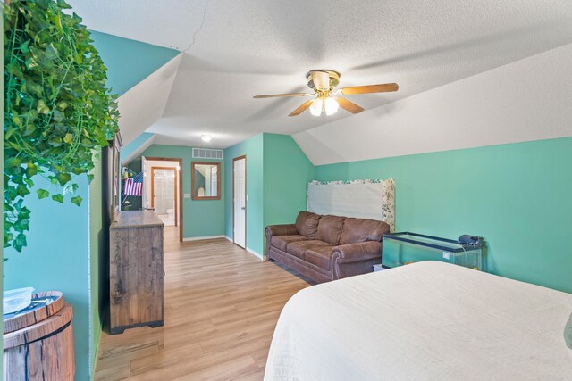 5700 Wilhite Rd, Columbia, MO 65202 - bedroom with wood finished floors, lofted ceiling, baseboards, and a ceiling fan