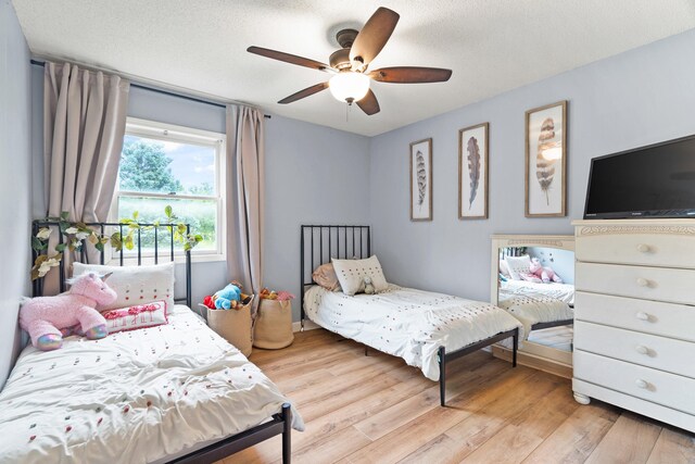 5700 Wilhite Rd, Columbia, MO 65202 - bedroom featuring light wood-style flooring and a ceiling fan
