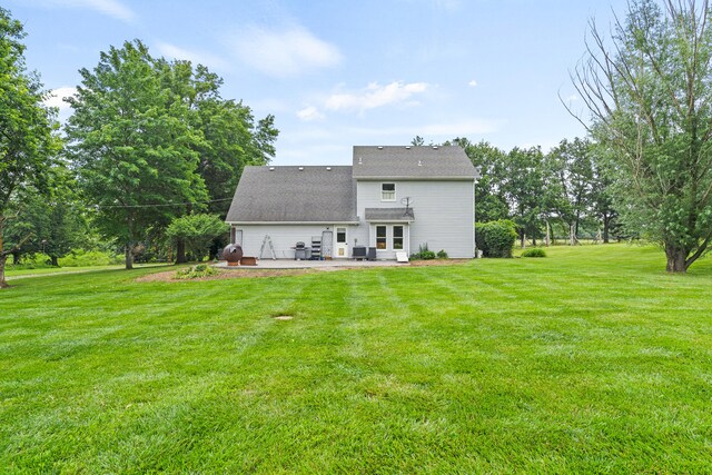 5700 Wilhite Rd, Columbia, MO 65202 - back of house featuring a patio, a yard, and roof with shingles
