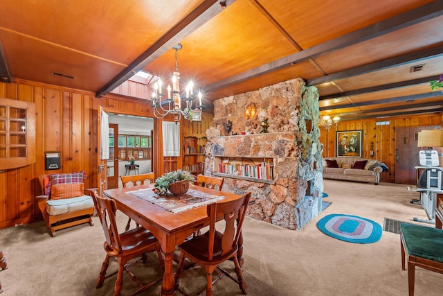304 W Maple St, Auxvasse, MO 65231 - dining area featuring a chandelier, carpet floors, beamed ceiling, and wood walls
