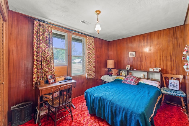 304 W Maple St, Auxvasse, MO 65231 - bedroom featuring wooden walls