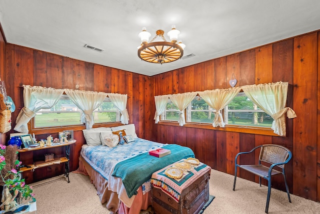 304 W Maple St, Auxvasse, MO 65231 - bedroom with carpet floors, wooden walls, and a chandelier