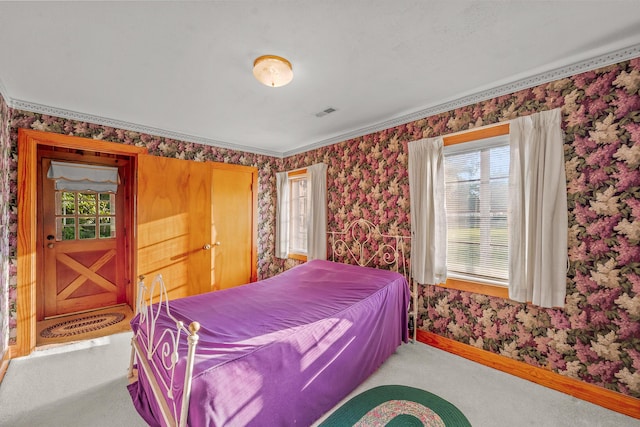 304 W Maple St, Auxvasse, MO 65231 - carpeted bedroom with wallpapered walls, multiple windows, baseboards, and ornamental molding
