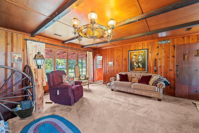 304 W Maple St, Auxvasse, MO 65231 - living room with carpet floors, wood walls, a chandelier, and beam ceiling