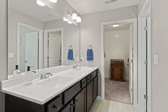 5817 Geyser Blvd, Columbia, MO 65202 - bathroom featuring double vanity and baseboards