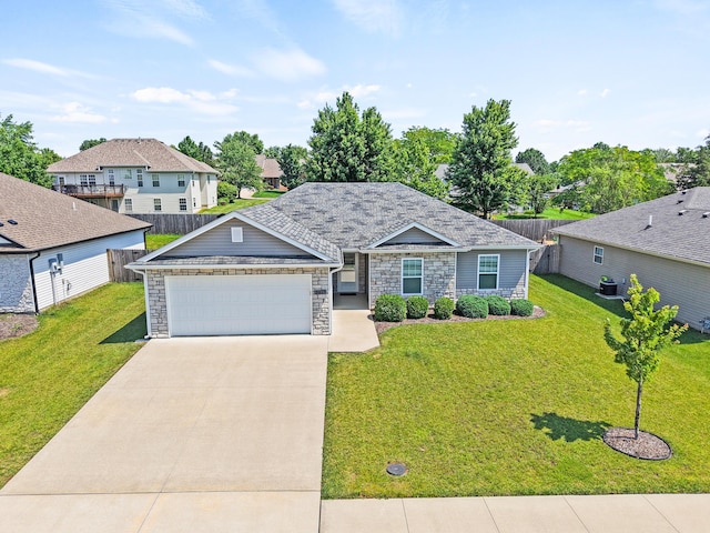 5817 Geyser Blvd, Columbia, MO 65202 - view of front of house with an attached garage, stone siding, concrete driveway, and a residential view
