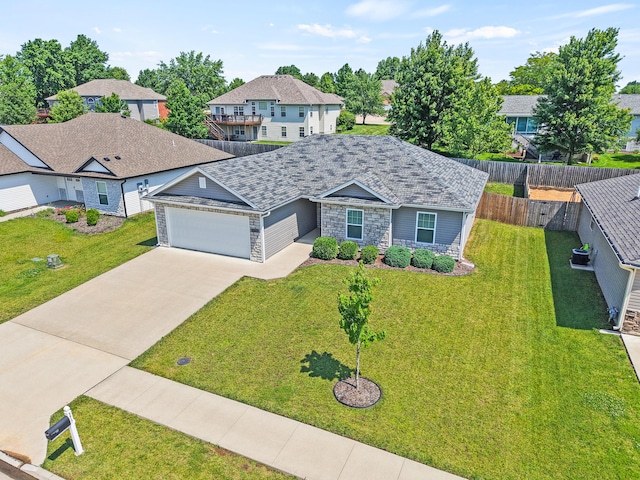 5817 Geyser Blvd, Columbia, MO 65202 - view of front of home featuring stone siding, an attached garage, driveway, and a residential view