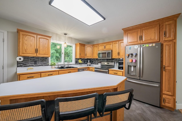 10060 E David Allen Rd, Columbia, MO 65201 - kitchen featuring stainless steel appliances, a sink, backsplash, and light countertops
